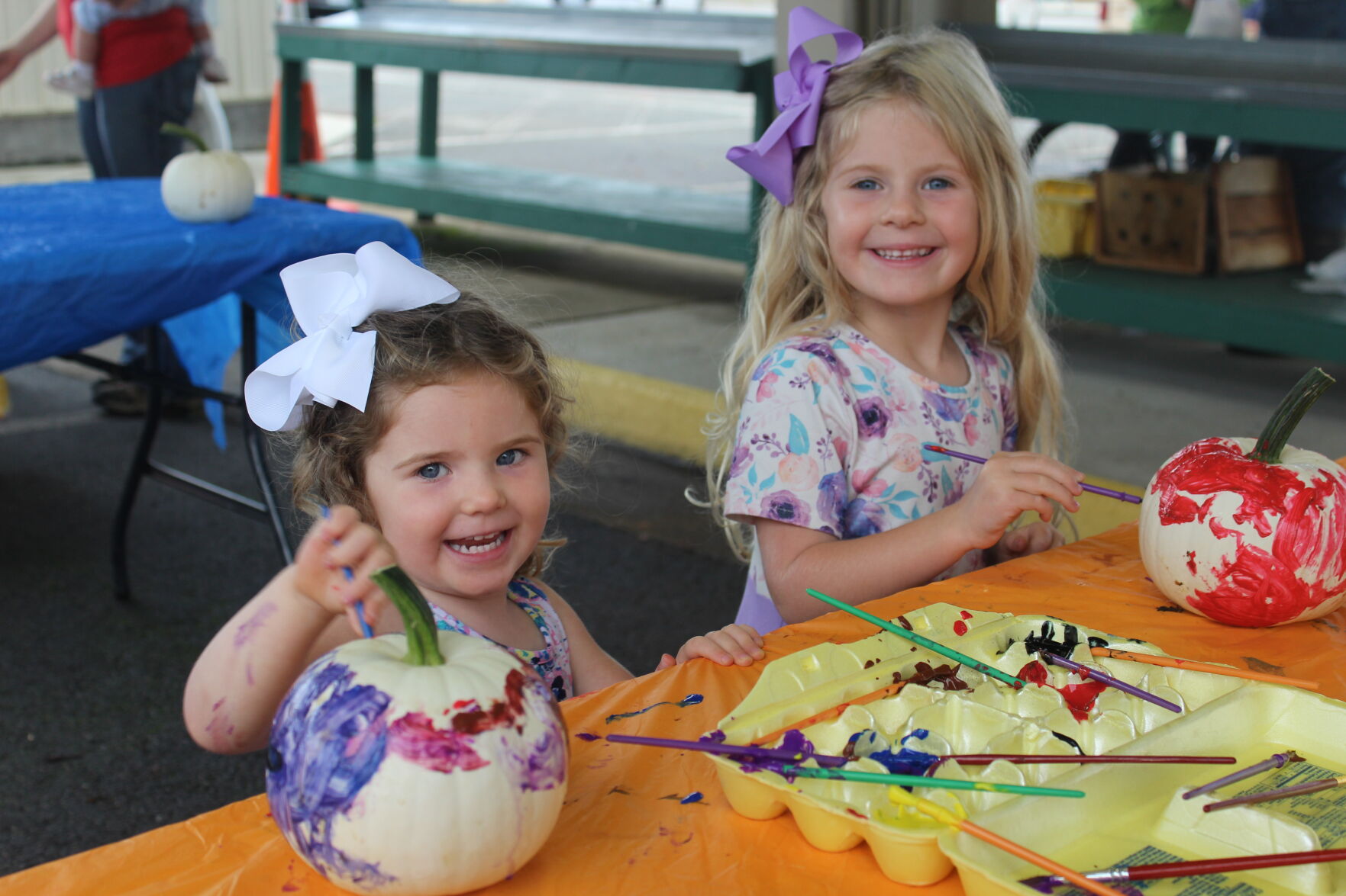 Ava and Tinley Womack painting pumkins.JPG